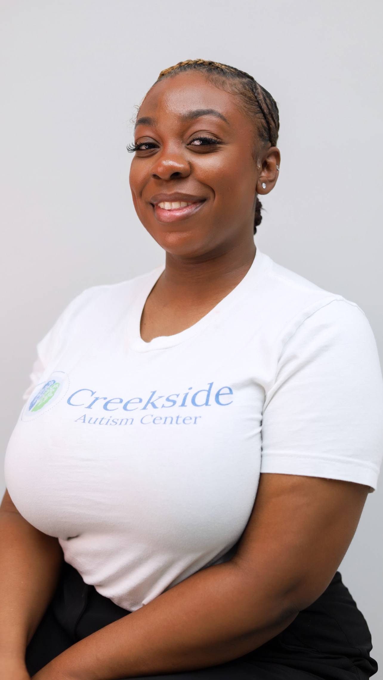 Creekside Autism Center - Headshot of employee wearing Creekside Autism Center t-shirt